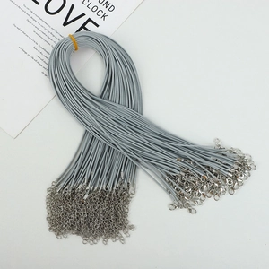 Detailed view of grey wax cord necklace chains with silver lobster clasps and extenders