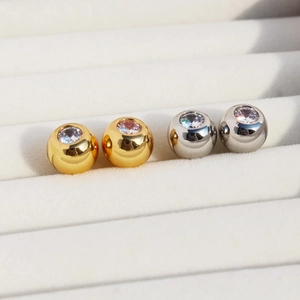 Classic round cubic zirconia stud earrings in gold and silver finish for women