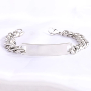 Detailed close-up of a 11mm silver stainless steel Cuban chain with a blank ID plate