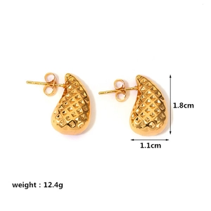 Detail of gold quilted water drop earrings showing 1.8cm height and 1.1cm width dimensions