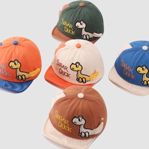 Detailed close-up of soft cotton baby baseball caps with cute dinosaur embroidery and fins
