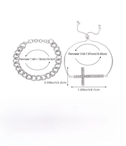 Detailed view of silver Cuban link rhinestone bracelet and cross pendant chain set
