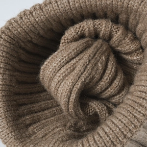 Brown knit beanie with thick ribbed texture, warm winter hat for outdoor comfort