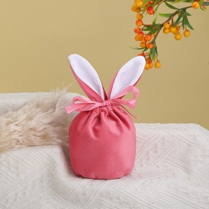 Close-up of pink velvet Easter bunny bag with long ears and silky drawstring ribbon detail