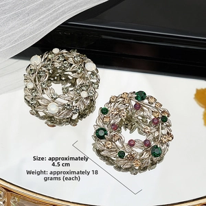 Close-up of baroque floral brooch with micro-pave crystals and pearls, 4.5cm diameter
