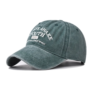Vintage washed dark green cotton baseball cap with embroidered Youth 1995 lettering