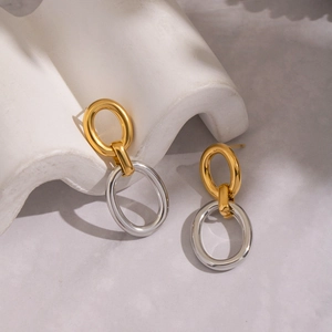 Boucles d'oreilles ovales entrelacées minimalistes au fini bicolore or et argent