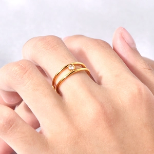Minimalist double-layered gold titanium steel ring with a sparkling zircon stone for women