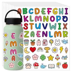 Close-up of cute cartoon alphabet stickers and icons applied to a green water bottle