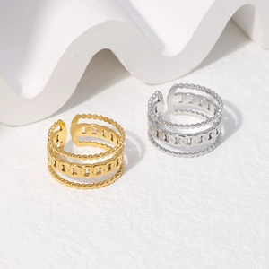 Detail of adjustable chain link rings in gold and silver finish with beaded edges