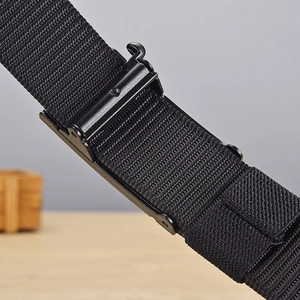 Detail of high-density nylon tactical belt with matte black metal buckle mechanism