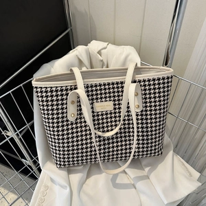 Chic houndstooth pattern tote bag with large capacity in a stylish shopping basket setting
