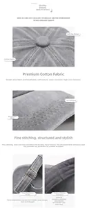 Detalles de una gorra de béisbol de algodón lavado gris con hebilla metálica y costuras.