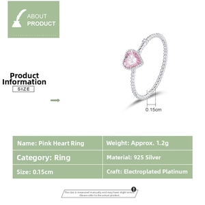 Macro detail of S925 sterling silver ring with pink heart zircon and twisted band