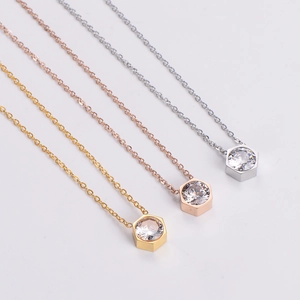 Hexagon pendant necklaces with sparkling zircon crystals in gold, silver, and rose gold