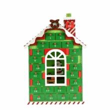 Detail of wooden 24-day advent calendar with red and green drawers and Santa scene