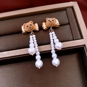 Elegant 18K gold plated pearl earrings featuring cute flocked brown bear studs for women