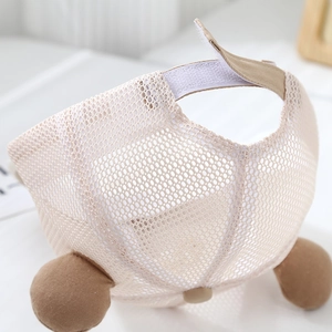 Detail view of mesh baby baseball cap with bear ears and adjustable velcro strap