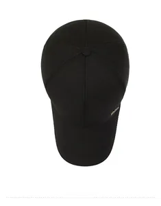 Top view of a black six-panel baseball cap with a subtle gold metal logo on the side