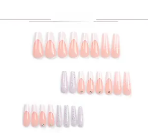 Detail of coffin press-on nails featuring French tips, silver glitter, and rhinestones