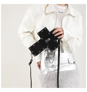 Cross-shaped gothic crossbody bag with silver skull motif and metal chain details
