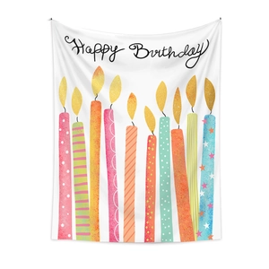 Detail of Happy Birthday wall tapestry with colorful candle illustrations on white fabric