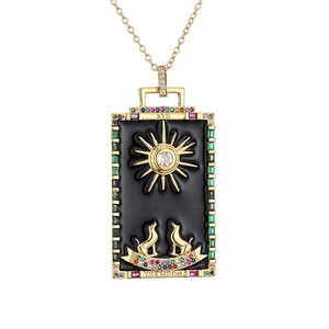 Gold tarot card pendant necklace with The Moon XVII design and zircon sun dog motif