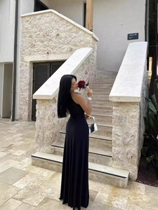 Elegant black backless maxi dress with a slim fit design for evening and formal occasions