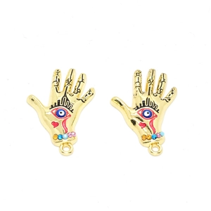 Detail of gold Hamsa hand charms with evil eye design and colored rhinestones for DIY jewelry