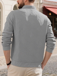 Detailed back view of men's grey knit sweater featuring unique geometric jacquard texture