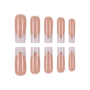 3D French coffin false nails in nude pink with white swirl lines and gold glitter detail