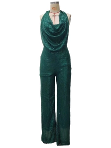 Detail of dark green halter cowl neck jumpsuit with shimmering sequins and wide-leg design