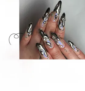 Macro detail of 3D silver fluid texture and sparkling rhinestones on almond fake nails