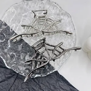 Silver spider web hair claws made of metal alloy for Halloween styling set of two