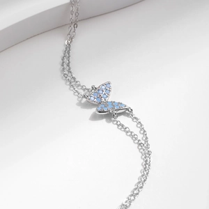 Elegant S925 silver double-layer bracelet featuring a delicate blue crystal butterfly charm