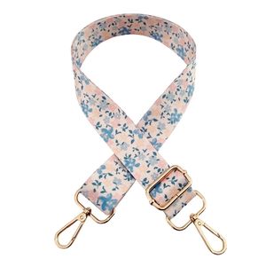 Adjustable floral print crossbody strap with gold metal buckles for bags and water bottles