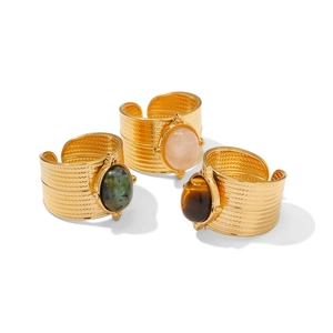 Three 18K gold-plated wide-band stainless steel rings with pink, green, and tiger eye stones