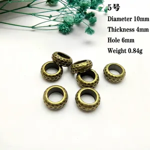 Macro shot of antique bronze 10mm flower wreath spacer beads for DIY jewelry making