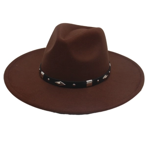 Detail of a brown fedora hat with a black belt featuring silver studs and diamond metal plates