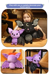 Detail of plush bat dolls with embroidered forehead star and crescent moon motifs