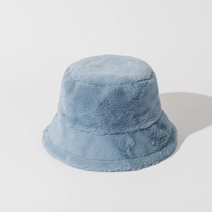 Detail of grey-blue faux rabbit fur bucket hat showing the thick plush texture for winter