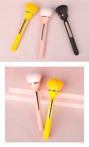 Detail of soft dense bristles on golden-trimmed makeup brushes with pink tiered stand