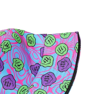 Detail of psychedelic bucket hat featuring melting smiley face print and parallel stitching
