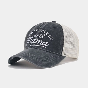 Close-up of vintage embroidery and distressed brim on breathable mesh ponytail cap