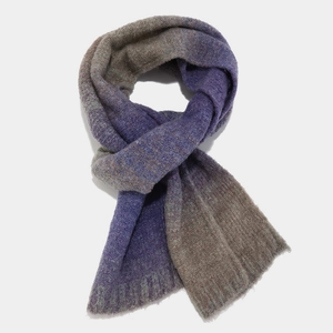 Detail of a purple gradient tie-dye knitted scarf with soft thick winter wool texture