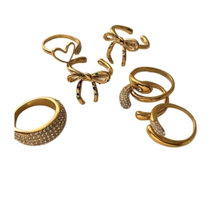 Adjustable golden bow and heart shaped ring set with sparkling zircon stones for women