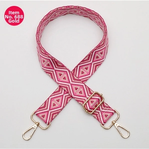 Close-up of pink diamond pattern woven strap with adjustable golden metal rotating buckles