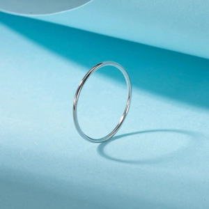 Minimalist S925 sterling silver thin band ring in polished silver finish on blue background