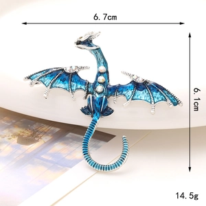 Blue enamel dragon brooch with sparkling rhinestones and detailed 6.7cm x 6.1cm dimensions