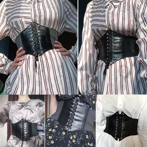 Multiple views of a black elastic lace-up corset belt styled on various outfits